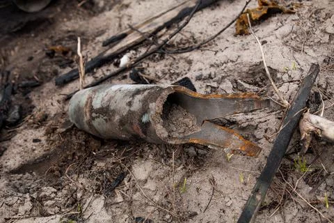 Exploding artillery shell on the ground Stock Photos