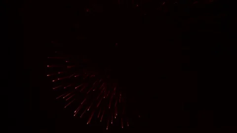 The exploding balls of fireworks leave behind smoke Stock Footage 95609986
