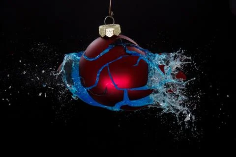 An exploding bauble. Concept for a ruined christmas Stock Photos