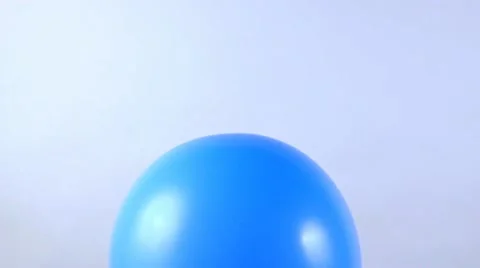 Exploding blue balloon Stock Footage