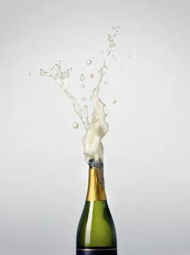 Exploding Bottle of Champagne for Celebration Stock Photos