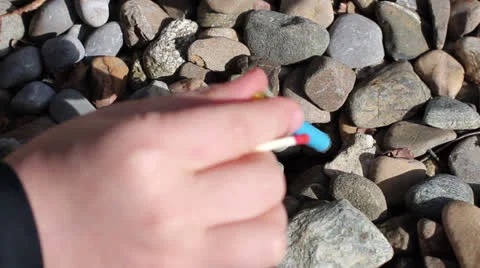 Exploding clacker in sand Stock Footage 22553465