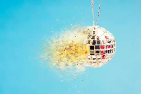 Exploding disco ball on blue background Foto stock