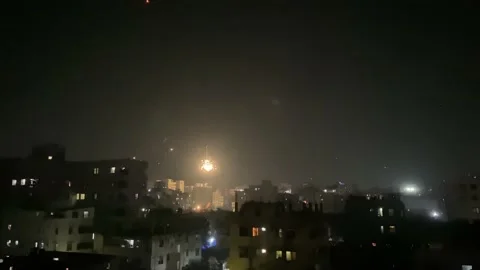 Exploding Fireworks Going Up In Night Sky In Dhaka. Locked Off Stock Footage 169149200