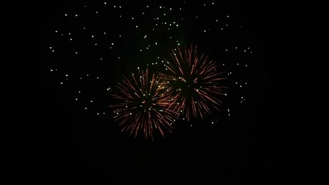 Exploding fireworks lighting up the night sky Stock Footage 153500072