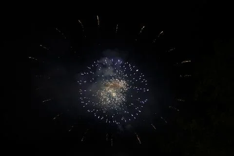 Exploding fireworks at night Stock Photos