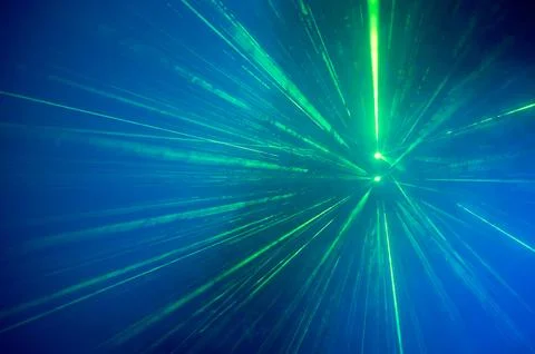Exploding Green Laser Beams Against Deep Blue Light Stock Photos