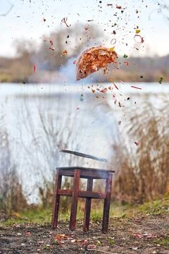 Exploding pizza in outdoor splash scene Stock Photos
