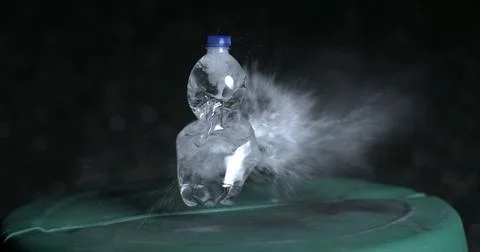 Exploding of plastic bottle of water in super slow-motion 800 fps, captured.. Stock Photos