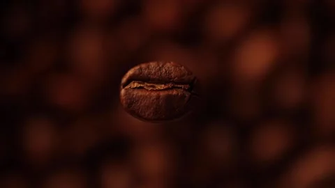 Exploding Premium Coffee Bean illuminated with light Stock Footage 156886721