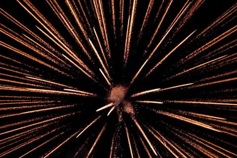 Exploding pyrotechnic firework sparks on night sky Stock Photos