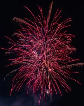 Exploding Red and Pink Fireworks at Night At Festival Stock Photos
