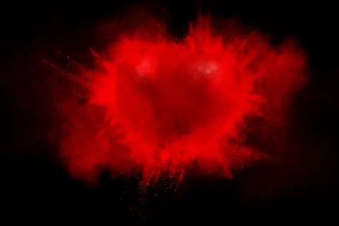 Exploding red heart on a black background Illustrazione stock