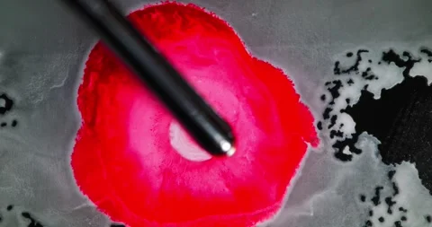 Exploding Red Ink Ring Forms Organic dark Central Eye Spreading Edges in Macro Stock Footage 306934519