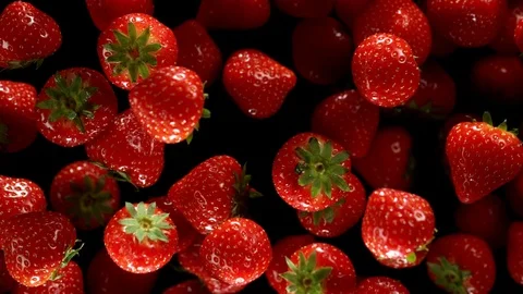Exploding strawberries with water on a black background. Stock Footage 122194946