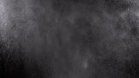 Exploding Stream of Ice Water Drops, Dust in Empty Space on a Black Background Stock Footage 258806657