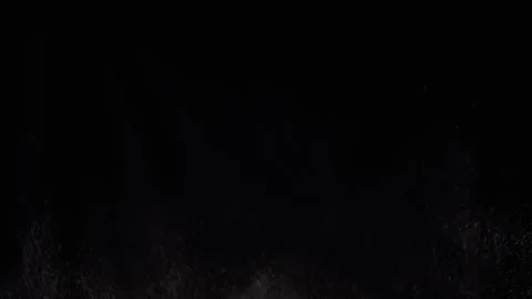 Exploding Stream of Ice Water Drops, Dust in Empty Space on a Black Background Stock Footage 263819827