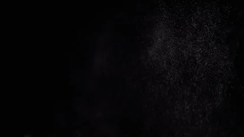 Exploding Stream of Ice Water Drops, Dust in Empty Space on a Black Background Video stock 263820250