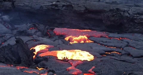 Exploding Volcanic Lava Eruption splashing out of crater molten lava Video stock 336579996