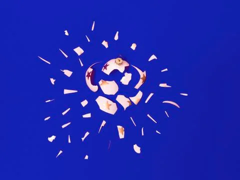 Exploding white bauble on blue background Stock Photos