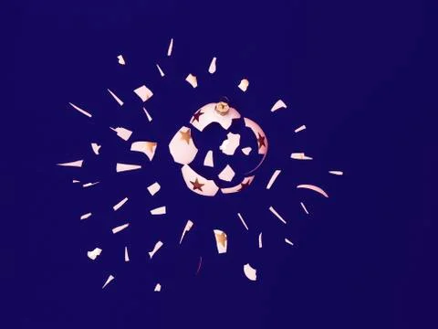 Exploding white bauble on blue background Stock Photos