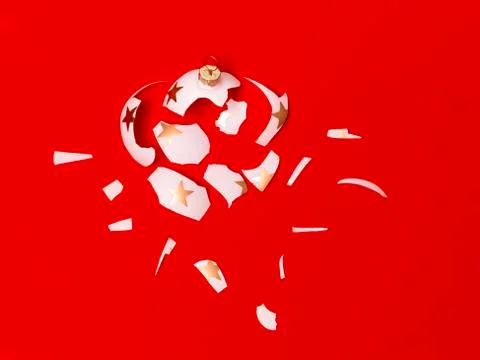 Exploding white bauble on red background Foto stock