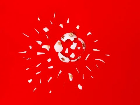 Exploding white bauble on red background Foto stock