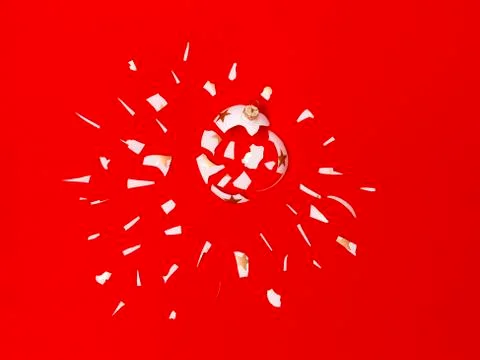 Exploding white bauble on red background Foto stock