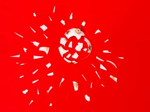 Exploding white bauble on red background Foto stock
