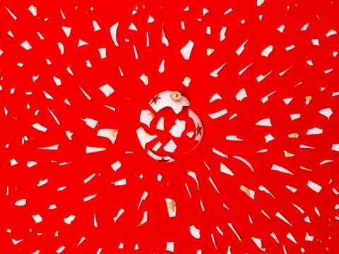 Exploding white bauble on red background Foto stock