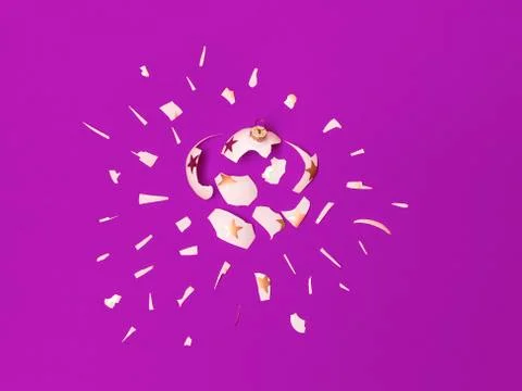 Exploding white bauble on violet background 스톡 사진