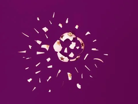 Exploding white bauble on violet background Foto stock