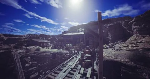Exploration of an abandoned western mining town under a bright sky Stock Illustration
