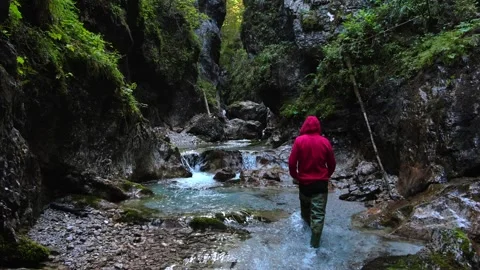 Exploration of an alpine stream with caves and canyons  Stock Footage 248201182