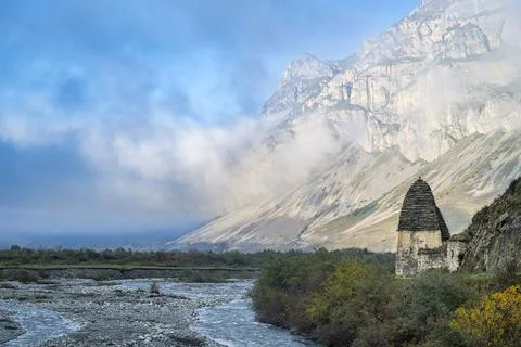 Exploration of the historical structures in Dargavs, set against the backdrop of Stock Photos