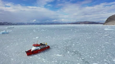 Exploration of ice fields in Greenland with a research vessel navigating  Stock Footage 328972125