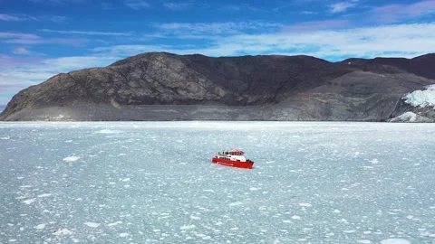Exploration of ice fields in Greenland with a research vessel navigating  Stock Footage 328972129