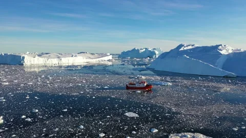 Exploration of ice fields in Greenland with a research vessel navigating  Stock Footage 328972130