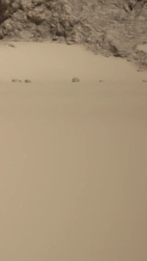 Exploration of a light beige wall with subtle texture and minor markings Stock Footage 340264151
