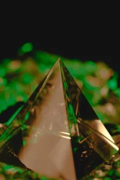 Exploration of light through a vibrant glass prismatic pyramid at dusk Stock Photos