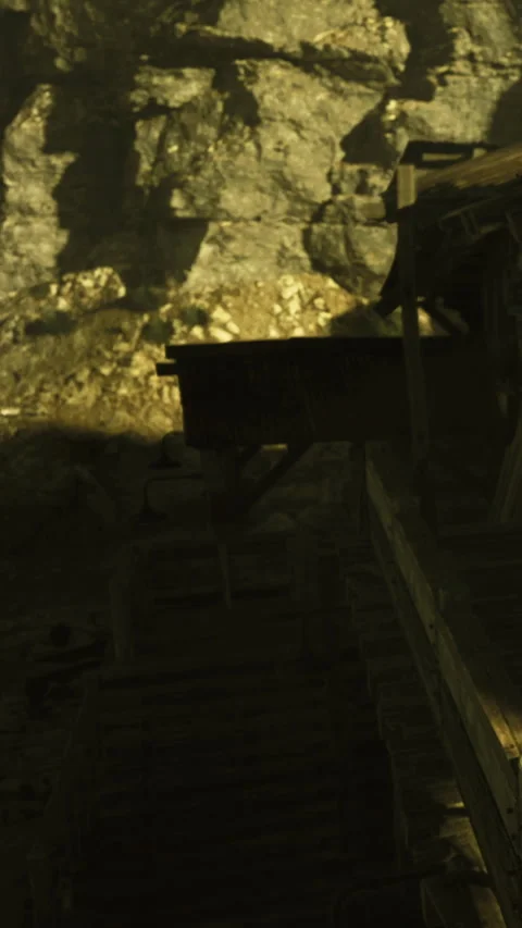 Exploration of an old mining site and wooden structures in a rocky area Stock Footage 330163218