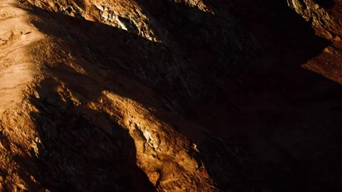 Exploration of rocky terrain with shadows at dusk on an alien planet Stock Footage 340028741