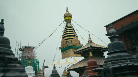Exploration of a sacred yellow temple surrounded by colorful prayer flags Stock Footage 321378585