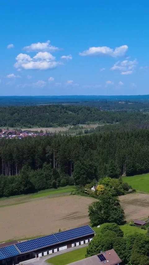 Exploration of a Serene Landscape Featuring Lush Forests and a Quaint Village Stock Footage 311112066