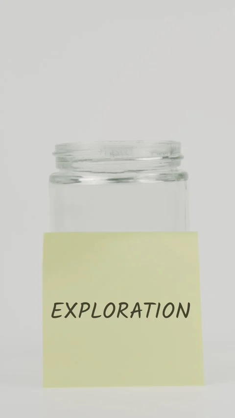 Exploration text or word on yellow sticky note attached to glass jar Stock Footage 311730411