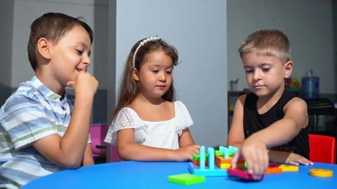 Explorative process Kindergarten students in classroom playing cognitive game Stock Footage 258901421