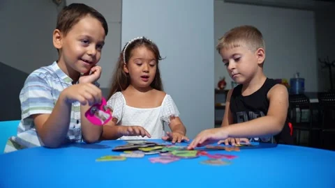 Explorative process Kindergarten students in classroom playing cognitive game Stock Footage 258901518