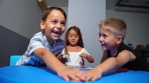 Explorative process Kindergarten students in classroom playing cognitive game Stock Footage 259050730