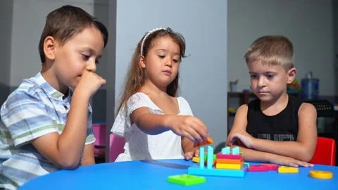 Explorative process Kindergarten students in classroom playing cognitive game Stock Footage 259634156