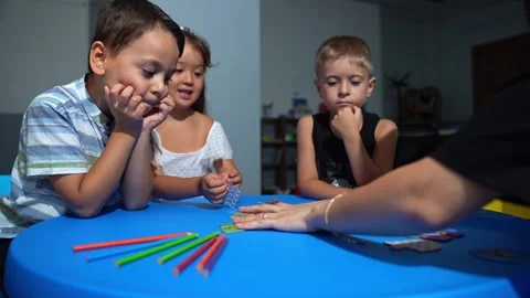 Explorative process Kindergarten students in classroom playing cognitive game Stock Footage 259826031